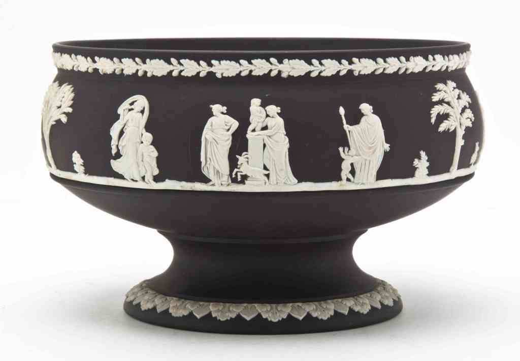 A Wedgwood Jasperware Center Bowl, Diameter 8 inc: A Wedgwood Jasperware Center Bowl, of circular form with a band of classical figures on a black ground, the foot with acanthus leaf decoration, impressed Wedgwood Made in England. Diameter 8 inches.