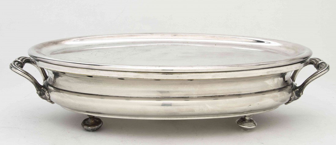 A French Silverplate Warming Tray, Christofle, Wi: A French Silverplate Warming Tray, Christofle, late 19th century, of handled oval form. Width over handles 18 inches.
