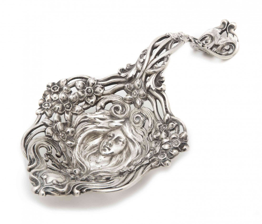 An American Sterling Silver Bon Bon Spoon, Black,: An American Sterling Silver Bon Bon Spoon, Black, Starr & Frost, the bowl centered with a bust of an art nouveau style maiden, with pierced floral and foliate decoration throughout; approximate weight