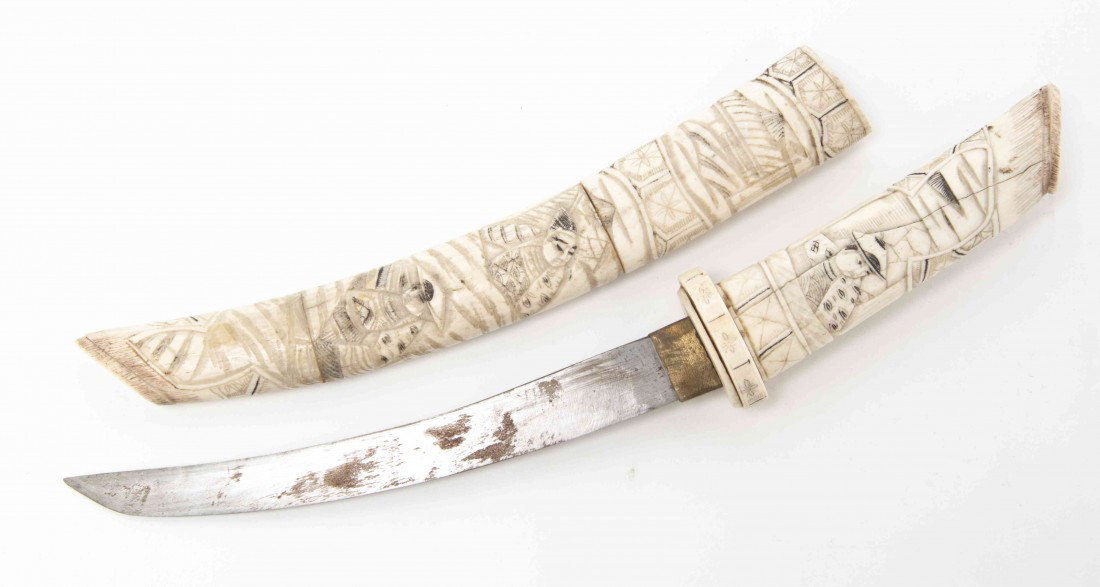 A Japanese Bone Cased Tanto, Length overall 12 3/: A Japanese Bone Cased Tanto, carved with figures. Length overall 12 3/4 inches.