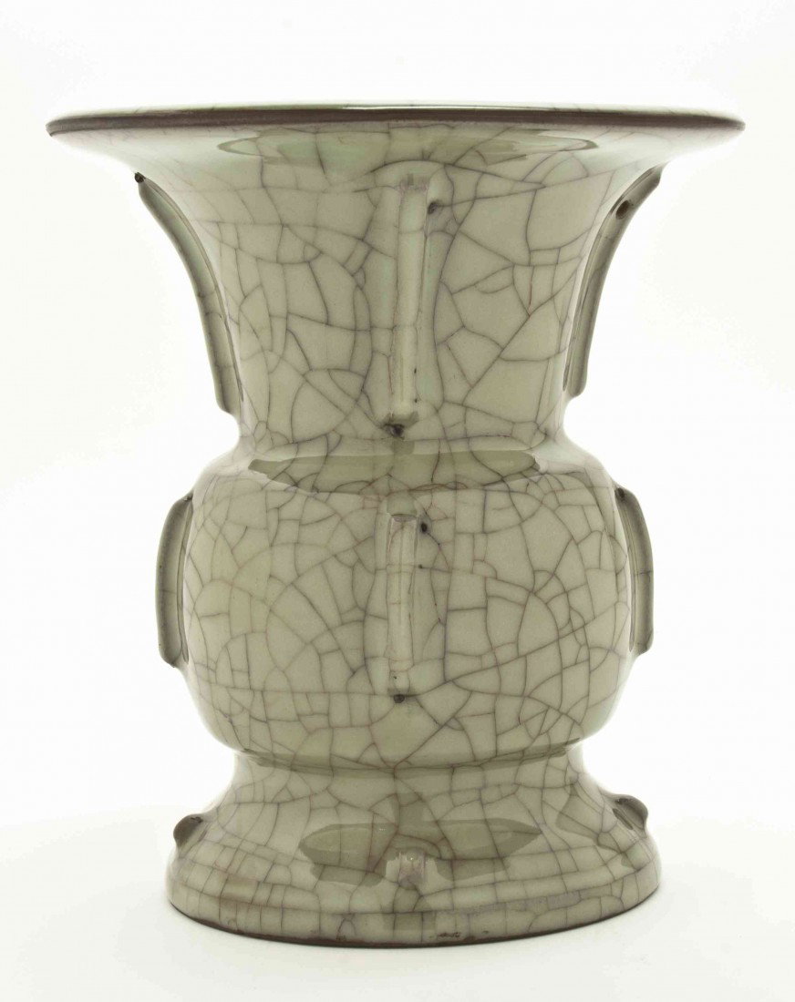 A Celadon Glazed Zhadou or Spittoon, Height 8 1/4: A Celadon Glazed Zhadou or Spittoon, with crackled tea stain glaze throughout having raked vertical ribs. Height 8 1/4 inches.