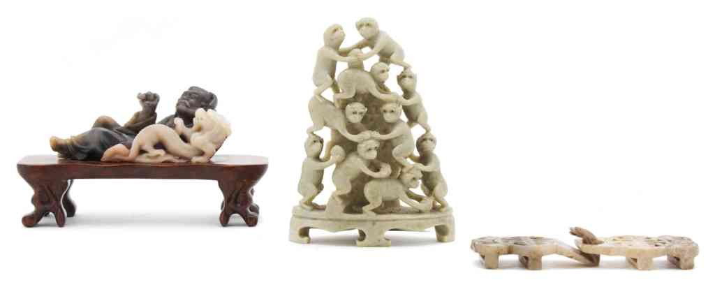 A Group of Three Chinese Carved Stone Articles, H: A Group of Three Chinese Carved Stone Articles, comprised of a soapstone carving of a Lohan in a recumbent pose with a dragon in grey and cream colored stone, a two piece buckle, likely Ming Dynasty a