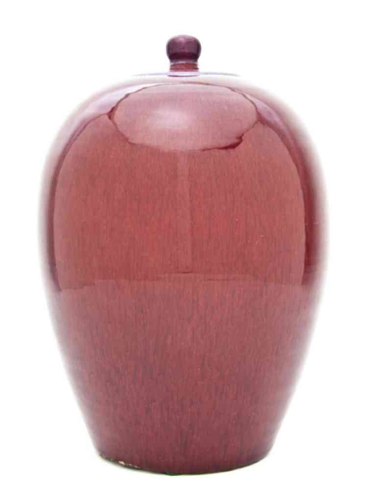 A Chinese Sang de Boeuf Glazed Ginger Jar, Height: A Chinese Sang de Boeuf Glazed Ginger Jar, of typical form with circular lid having knob finial, unmarked. Height overall 12 1/2 inches.