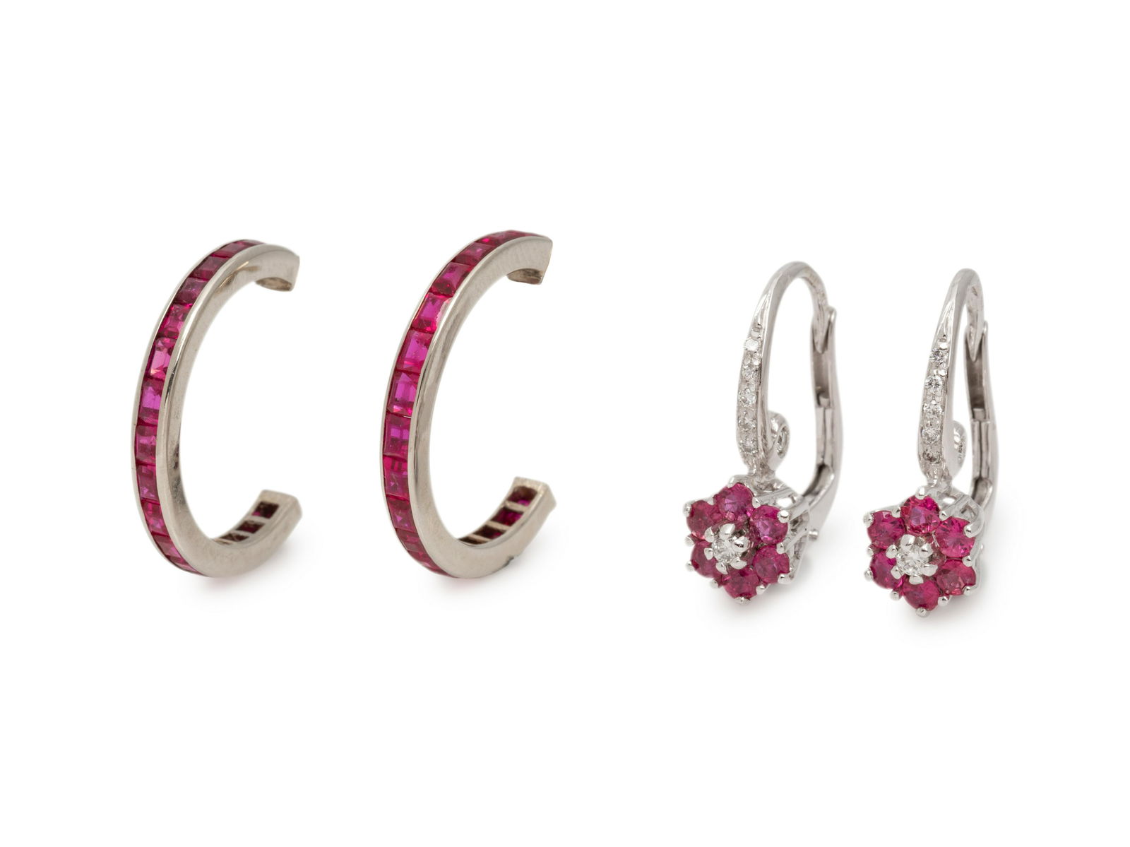COLLECTION OF RUBY EARRINGS: COLLECTION OF RUBY EARRINGS Consisting of a pair of half hoop earrings containing 34 baguette cut rubies, together with a pair of earrings containing 12 round mixed cut rubies and 12 round brilliant c