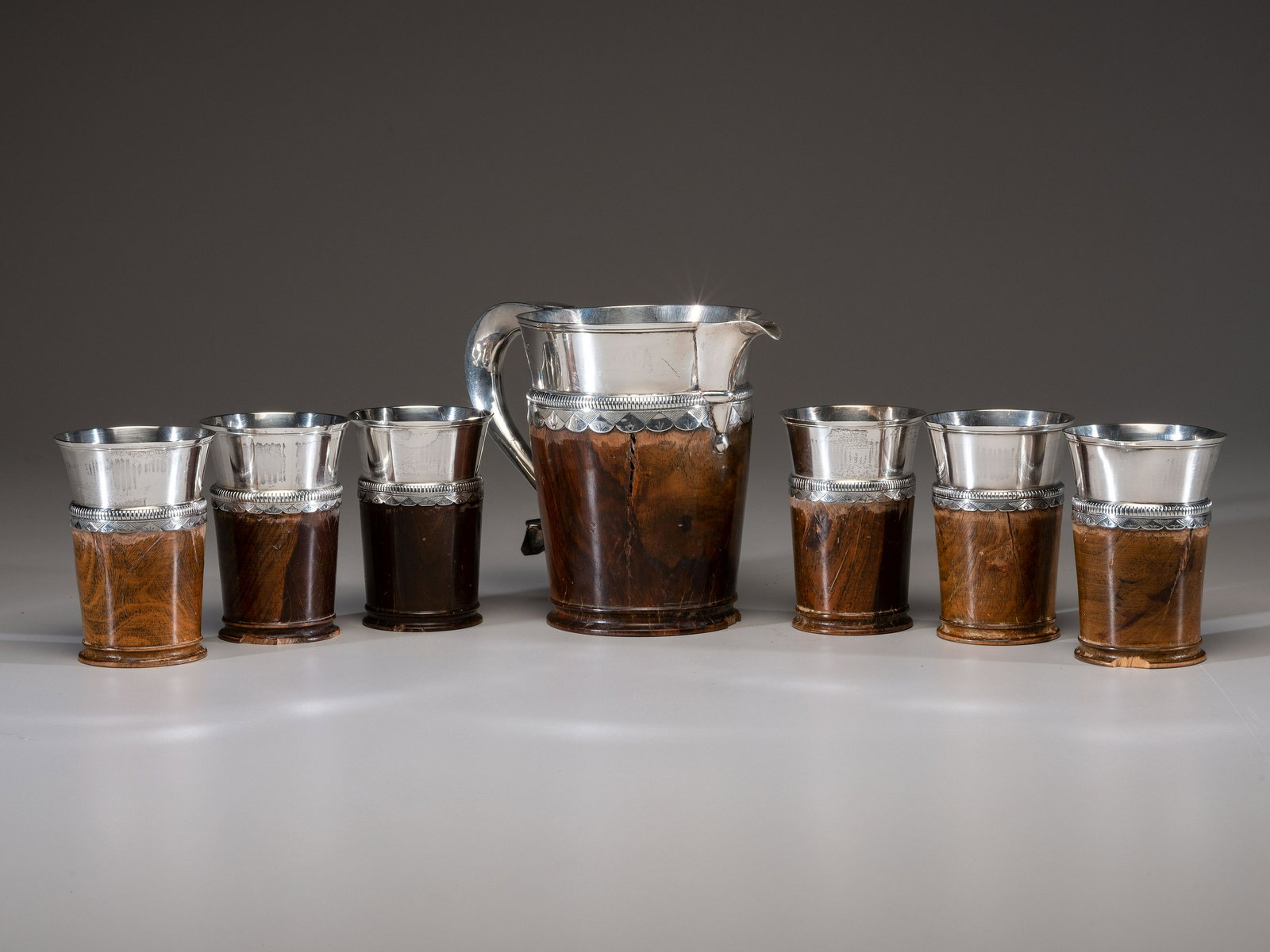 A Silver Mounted Mahogany Pitcher and Six Cups (1 of 6)