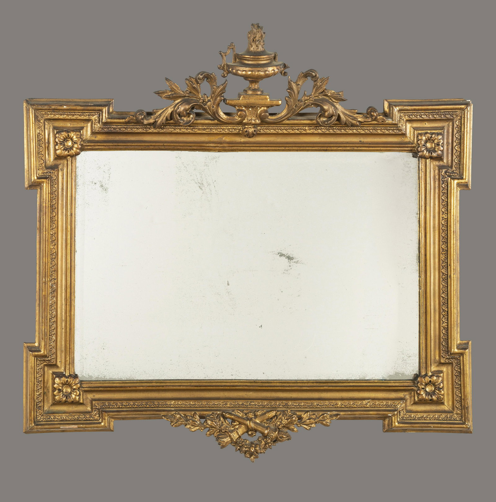 A Neoclassical Giltwood Overmantel Mirror: A Neoclassical Giltwood Overmantel Mirror Early 19th Century 37 x 38 1/2 inches.