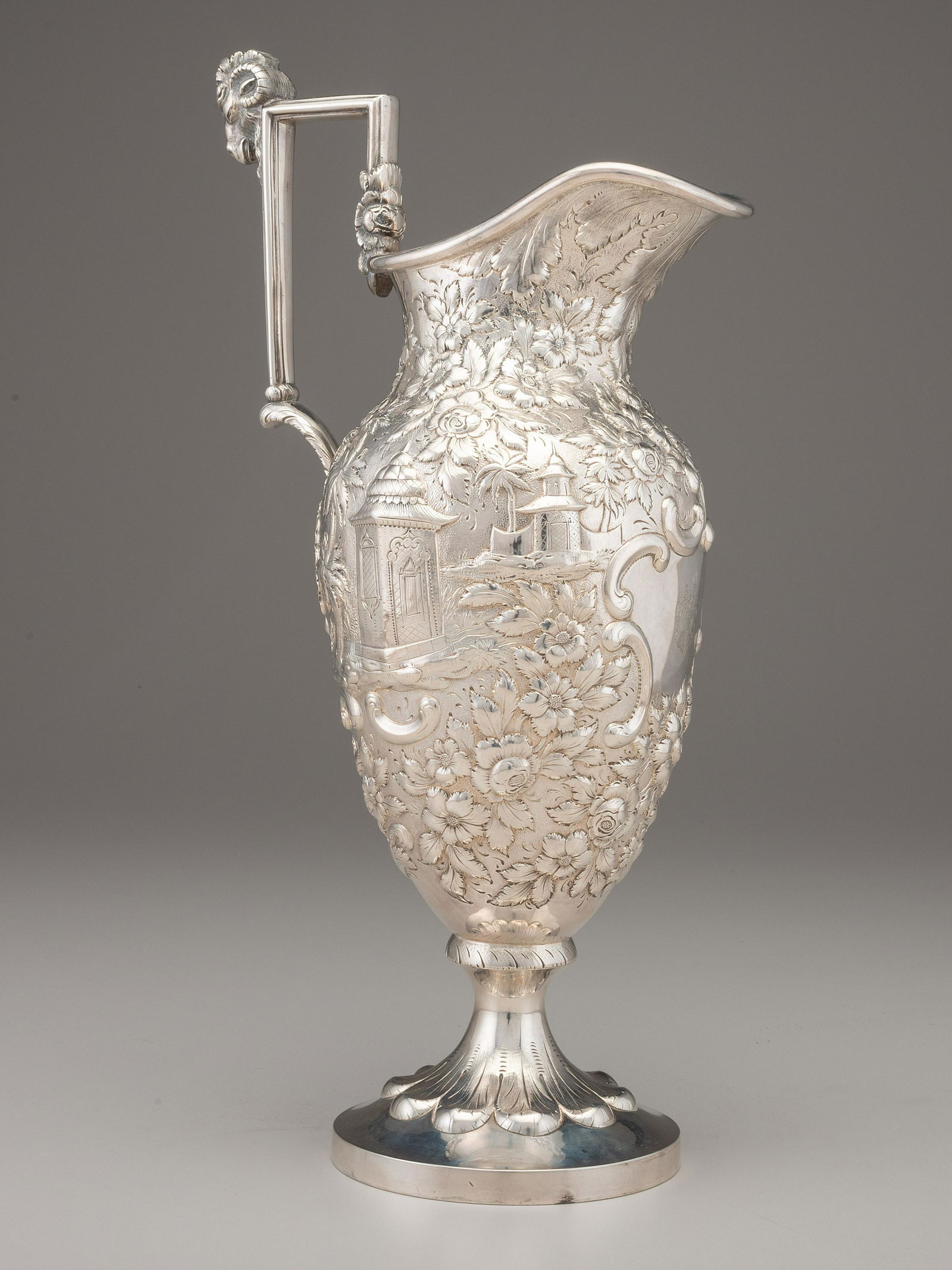An A.E. Warner Coin Silver Pitcher: An A.E. Warner Coin Silver Pitcher Baltimore, Maryland, Circa 1865 with maker's mark and 11-2 standard mark on side of foot. with coat of arms engraving to cartouche and engraved on interior rim of fo