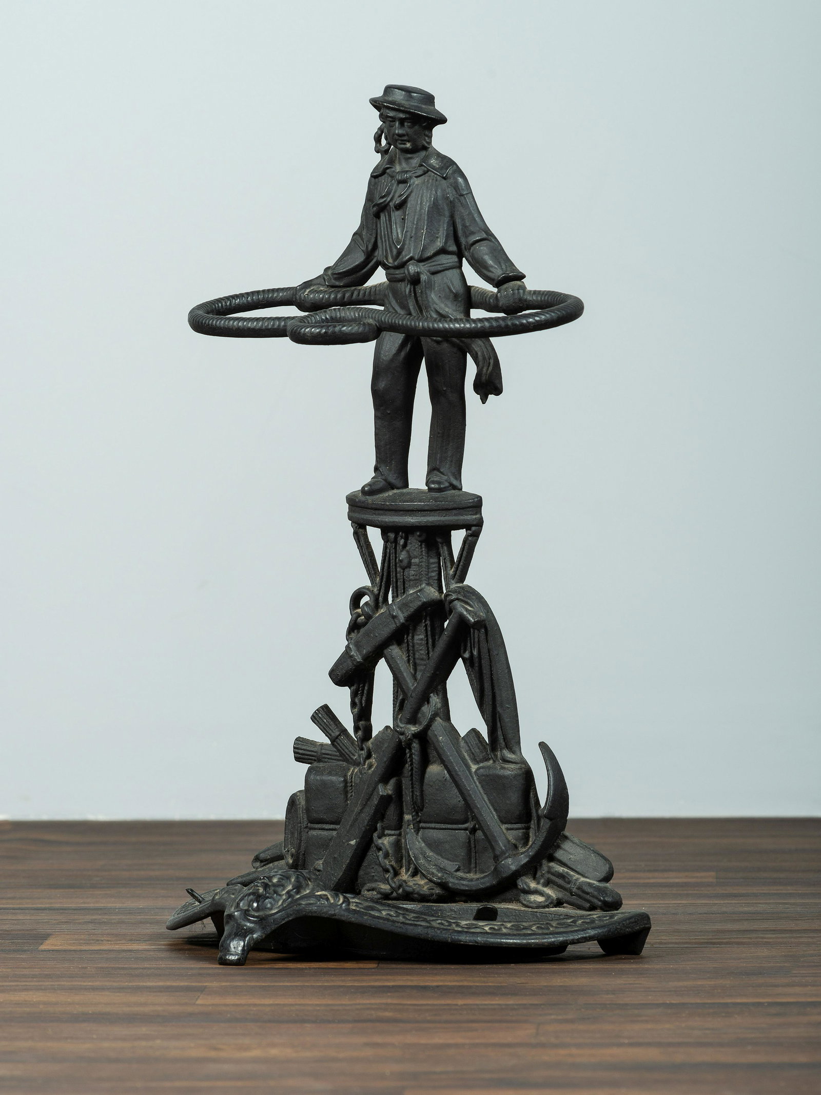A Cast Iron Sailor Umbrella Stand: A Cast Iron Sailor Umbrella Stand 20th Century Height 27 7/8 inches.