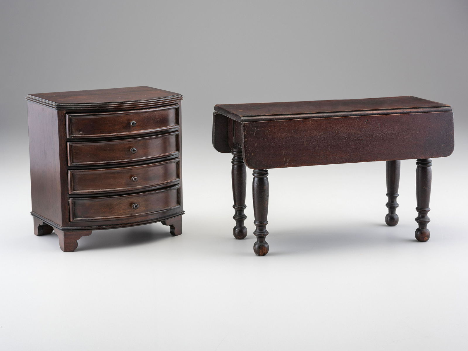 A Miniature Bow Front Chest of Drawers and Drop-Leaf Dining Table (1 of 5)