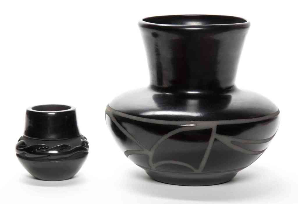 Two Santa Clara Blackware Pottery Vases, Height of : Two Santa Clara Blackware Pottery Vases, one of baluster form, dated 1990 and having a geometric band, the other a Linda Cain example with carved Awanyu spirit decoration. Height of taller 7 inches. P