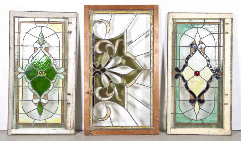 A Near Pair of Leaded Glass Windows, Height of tall: A Near Pair of Leaded Glass Windows, each having stylized foliate decoration within a linear border, together with a similar window. Height of tallest 47 7/8 x width 27 1/2 inches. Property from the E