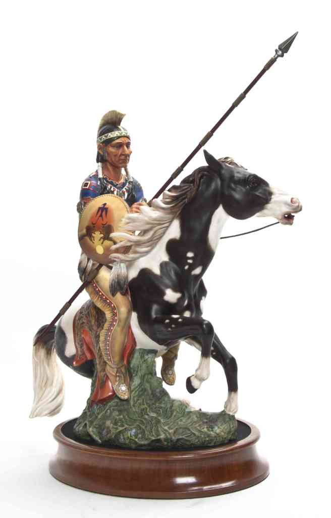 A Royal Doulton Figural Group, Height 18 3/4 inches: A Royal Doulton Figural Group, depicting a Native American seated atop a horse holding a spear. Height 18 3/4 inches.