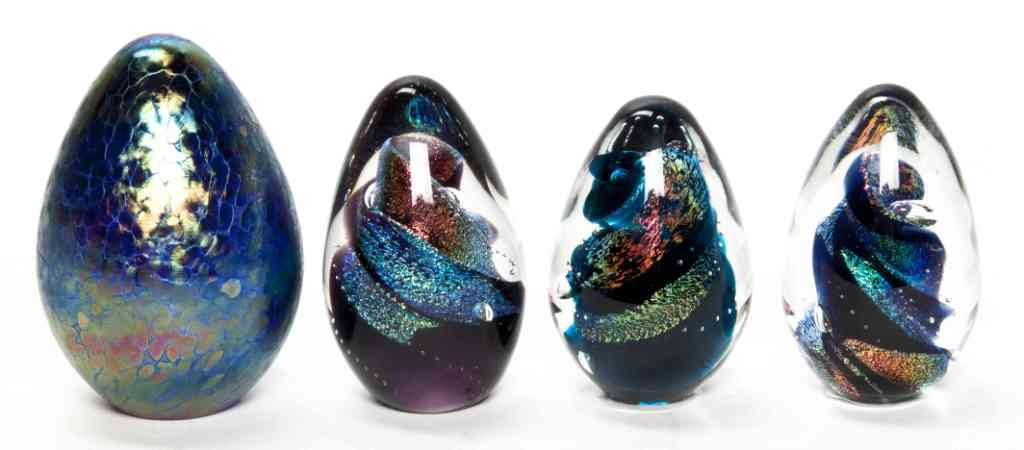 A Set of Three Italian Glass Egg Form Paperweights: A Set of Three Italian Glass Egg Form Paperweights, each with internal metallic and metallic twist decoration together with an iridescent and cobalt blue example, signed indistinctly and dated 94. Hei