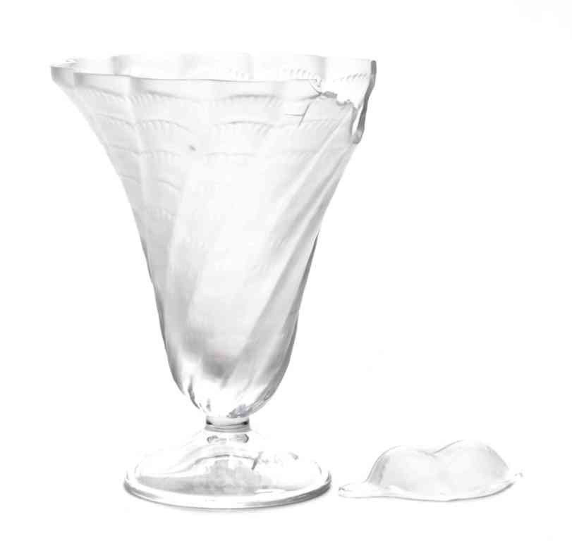 A Lalique Glass Stem, Height 6 inches.: A Lalique Glass Stem, having a flared rim raised on a circular foot, marked Lalique France. Height 6 inches. Property from the Collection of Mr. and Mrs. John F. Monroe, Milwaukee, Wisconsin