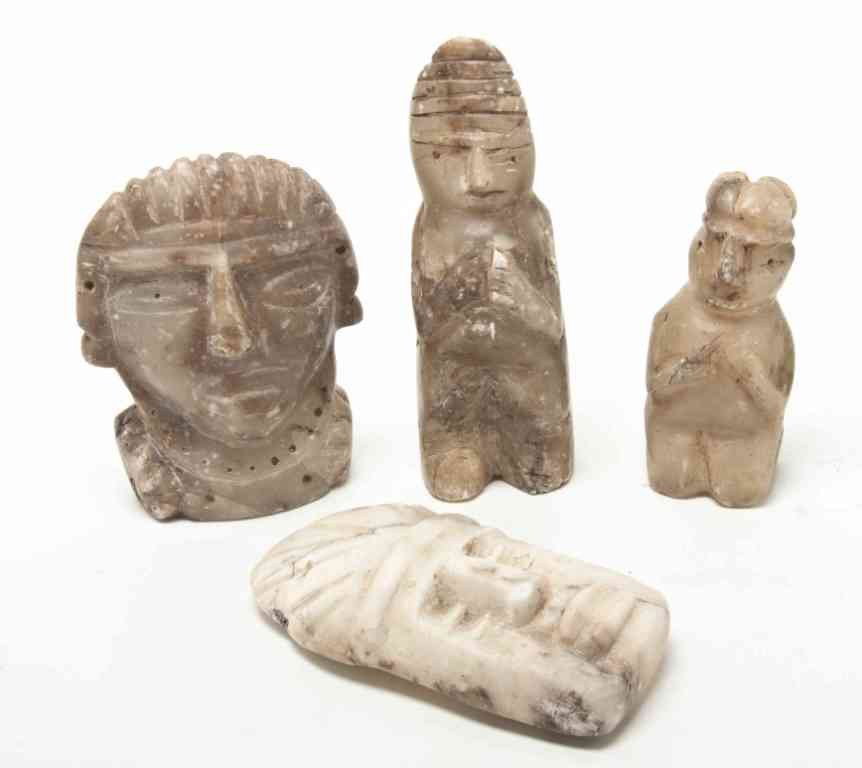 A Collection of Four Pre-Colombian Carved Hardston: A Collection of Four Pre-Colombian Carved Hardstone Articles, comprising two masks, a standing figure and a kneeling figure. Height of tallest 7 1/2 inches. Property from the Collection of Mr. and Mrs