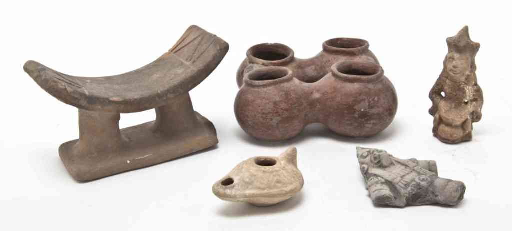 A Collection of Pre-Colombian Articles, Width of w: A Collection of Pre-Colombian Articles, comprising a neck rest, a four-part vessel, an oil lamp, a figure of a drummer and one other. Width of widest 6 1/4 inches. Property from the Collection of Mr. 