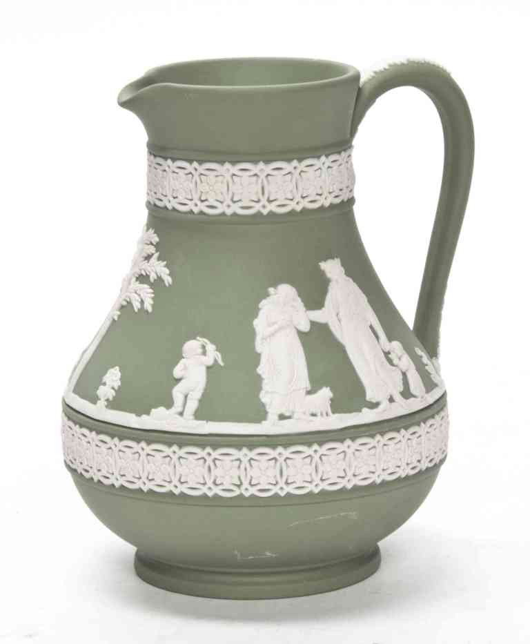 A Wedgwood Jasperware Pitcher, Height 6 inches.: A Wedgwood Jasperware Pitcher, decorated with a continuous band of classical figures in white on a green ground, impressed Wedgwood, Made in England. Height 6 inches.