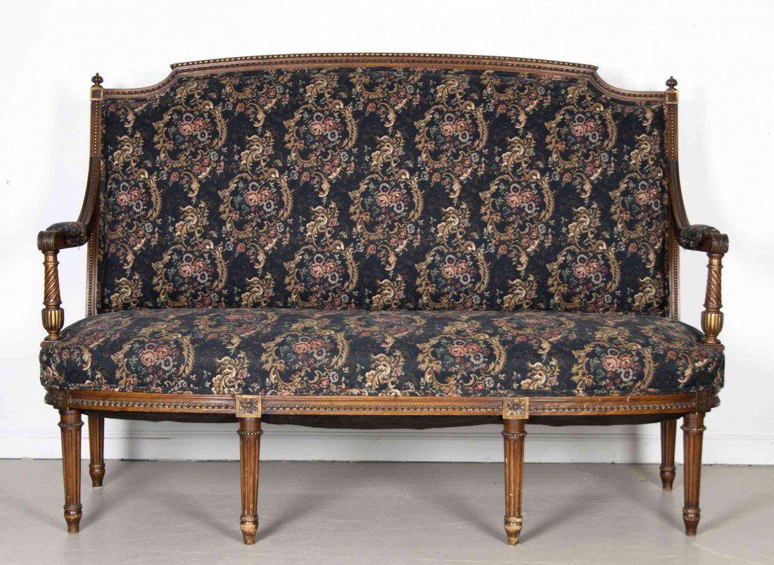 A Louis XV Style Parcel Gilt Settee, Height 42 5/8: A Louis XV Style Parcel Gilt Settee, having carved finials and acanthus leaf decoration to the arms, raised on fluted and tapering legs. Height 42 5/8 x width 57 1/2 x depth 25 inches.