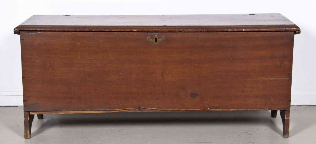 An American Pine Trunk, Height 20 1/2 x width 48 x: An American Pine Trunk, of rectangular form, with hinged top over the conforming case raised on twin supports. Height 20 1/2 x width 48 x depth 15 inches. Property from the Estate of Mary Sayre, Chica