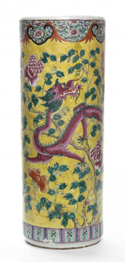 A Chinese Enameled Umbrella Stand, Height 23 3/4 i: A Chinese Enameled Umbrella Stand, decorated with peonies and a sinuous dragon on a yellow ground. Height 23 3/4 inches.