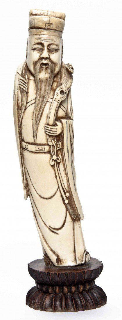 A Chinese Carved Ivory Figure of a Man, Height 9 1: A Chinese Carved Ivory Figure of a Man, depicting a bearded scholar with robe and scepter. Height 9 1/2 inches.
