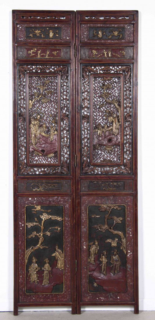 A Chinese Lacquered and Parcel Gilt Two Panel Floo: A Chinese Lacquered and Parcel Gilt Two Panel Floor Screen, each panel decorated with flowering urns and figures crossing a bridge over a pierced section depicting figures among trees with bats at the