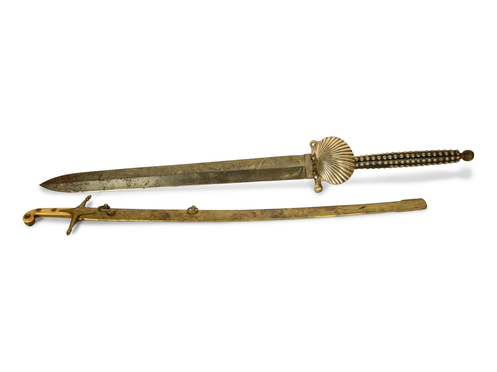 Two Presentation Swords: Two Presentation Swords 20th Century comprising a Spanish commemorative example with a nailhead-decorated leather handle and engraved motif to the blade; and a curved example with brass sheath and bon