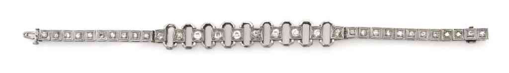 An Edwardian Platinum and Diamond Bracelet, 18.25 d: An Edwardian Platinum and Diamond Bracelet, containing ten old mine cut diamonds weighing approximately 1.64 carats and 21 round single cut diamonds weighing approximately 0.84 carat total. 18.25 dwts
