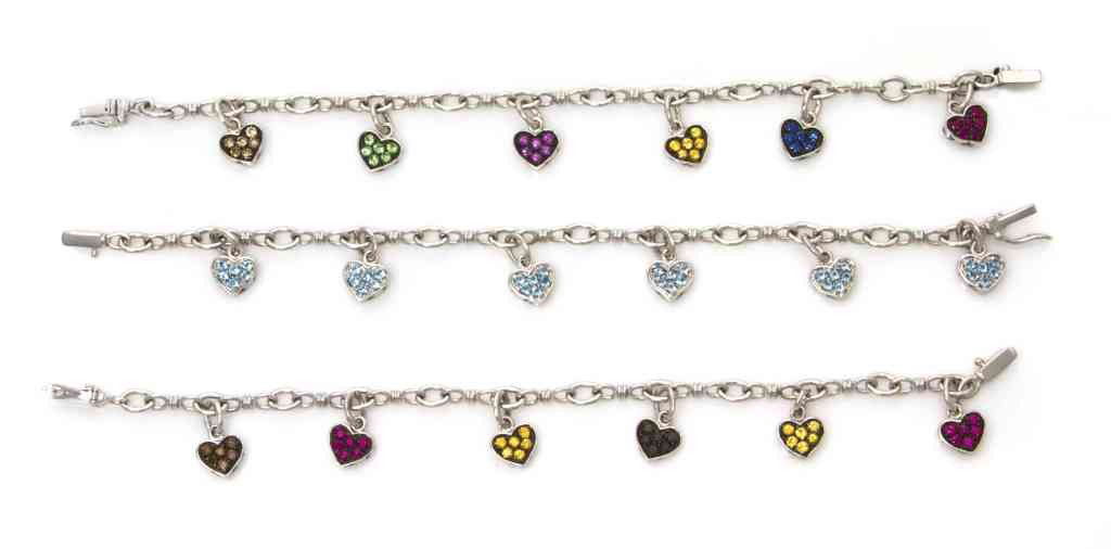 A Group of 18 Karat White Gold and Multi Color Gem: A Group of 18 Karat White Gold and Multi Color Gem Bracelets, consisting of three link bracelets, each with six heart shape gem set pendants, containing numerous round brilliant cut aquamarines and nu