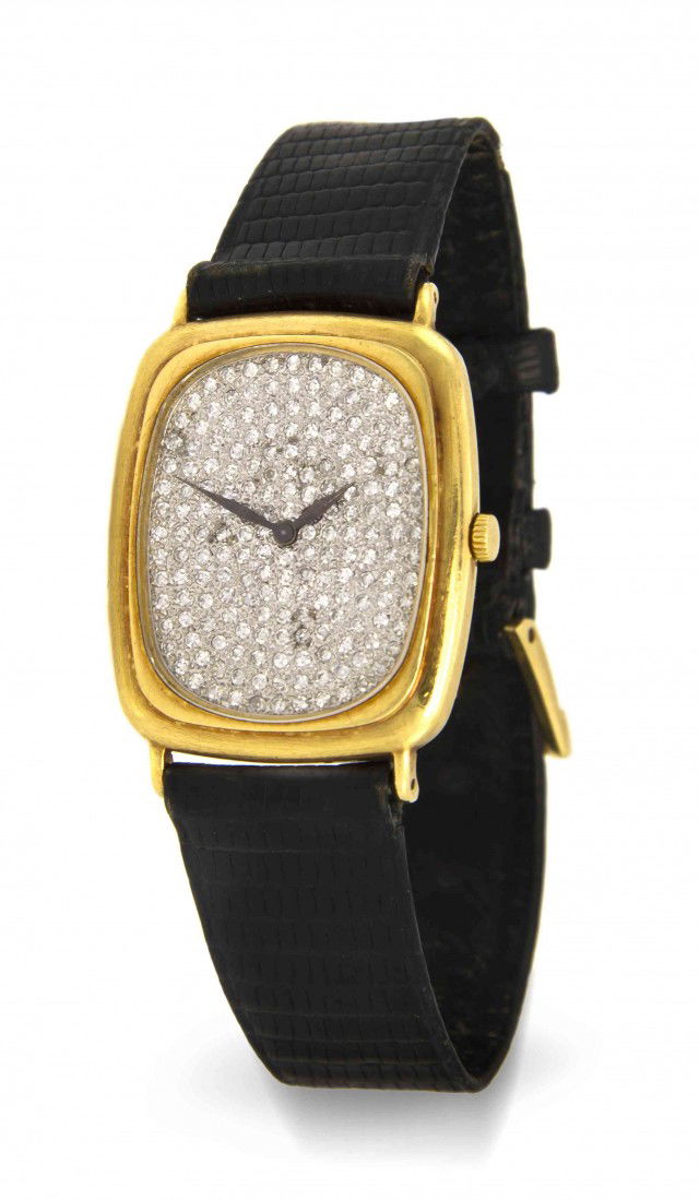 An 18 Karat Yellow Gold and Diamond Wristwatch, Pi: An 18 Karat Yellow Gold and Diamond Wristwatch, Piaget, 30.00 x 26.00 mm case dimensions, dial contains numerous round single cut diamonds, blued steel spade hands, cushion shape case, case back affix