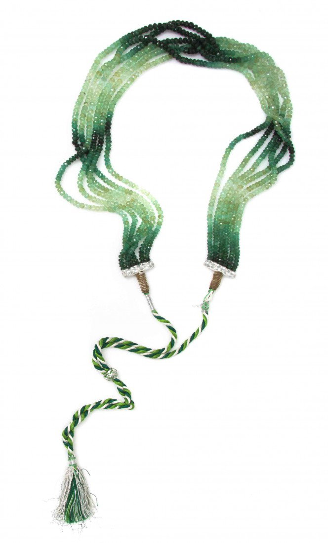 A Multi Strand Emerald and Green Beryl Bead Neckla: A Multi Strand Emerald and Green Beryl Bead Necklace, strung with six strands of emerald and green beryl rondelle beads in graduating color and length, silk cord ties. 66.00 dwts. Property from the Es