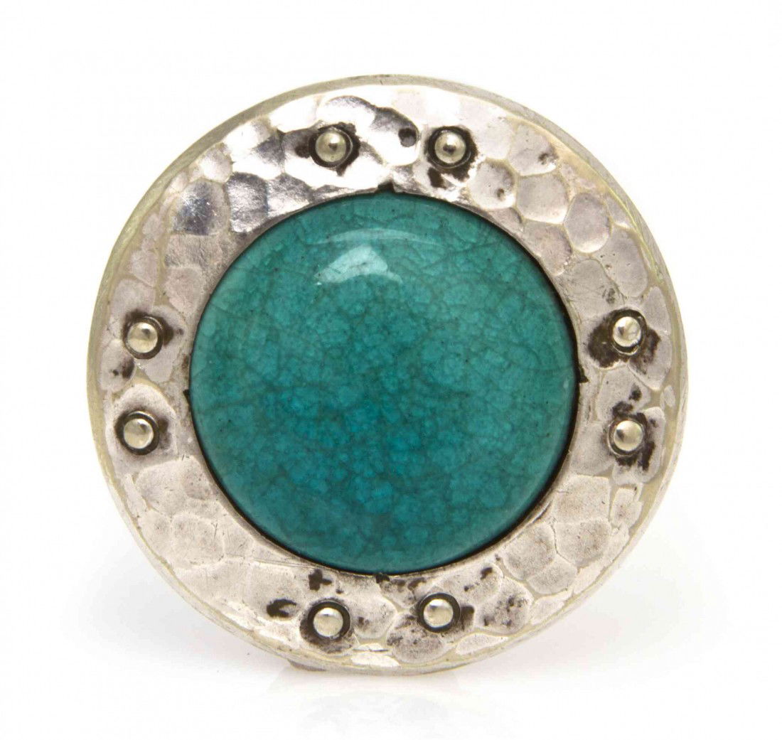 A Sterling Silver and Enamel Circular Brooch, 6.28: A Sterling Silver and Enamel Circular Brooch, measuring approximately 30.00 mm in diameter. Stamp: REG TRADE MARK PLANTAGENET HAND WROUGHT REGSTN PENDING. 6.28 dwts.