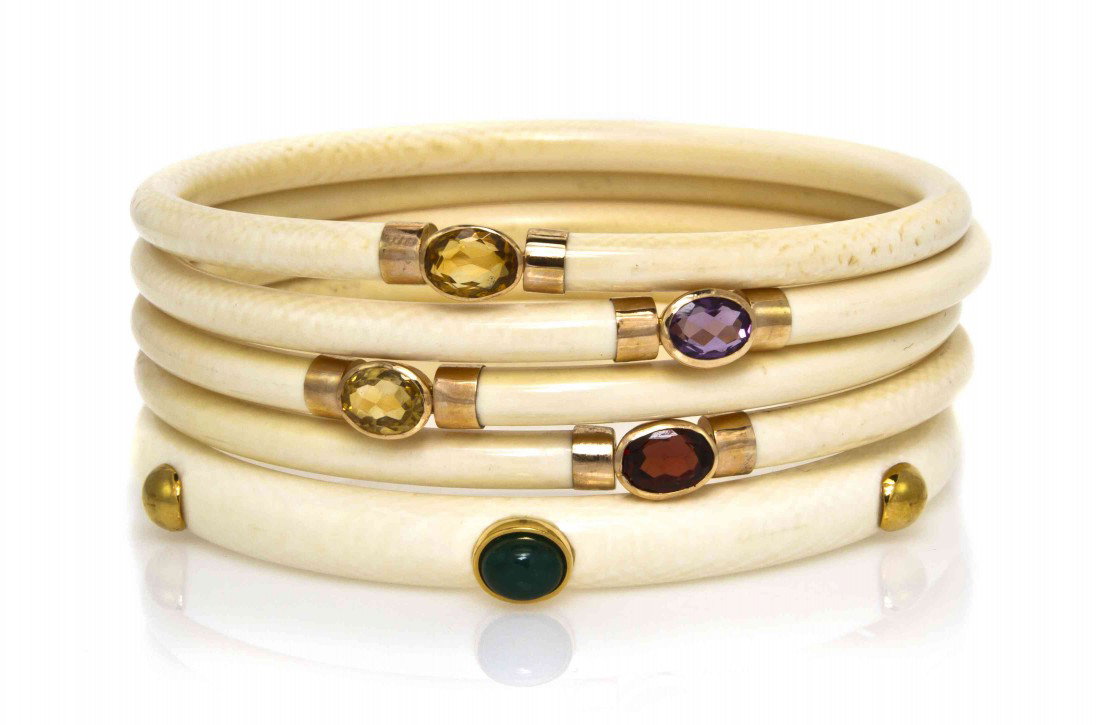 A Group of 14 Karat Yellow Gold, Ivory and Gem Ban: A Group of 14 Karat Yellow Gold, Ivory and Gem Bangle Bracelets, consisting of bangles containing bezel set amethyst, garnet, citrine, lapis lazuli, carnelian and dyed green quartz. Stamp: 14K 585. 27
