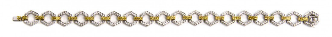 An 18 Karat Two Tone Gold, Fancy Yellow and White : An 18 Karat Two Tone Gold, Fancy Yellow and White Diamond Bracelet, containing 252 round brilliant cut diamonds weighing approximately 1.26 carats total and 54 round brilliant cut fancy yellow diamond