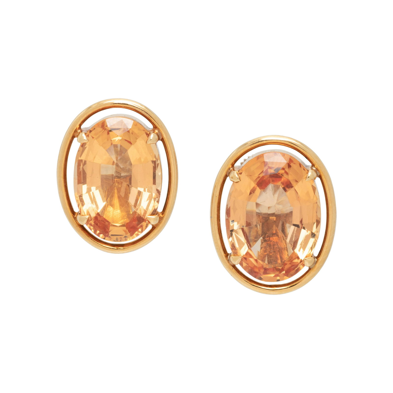 ROSE GOLD AND TOPAZ EARCLIPS: ROSE GOLD AND TOPAZ EARCLIPS Containing two oval mixed cut topaz measuring approximately 15.65 x 11.30 mm and 14.95 x 10.35 mm, with screw backs. 3/4 inch long. Gross weight: 6.35 dwt. 