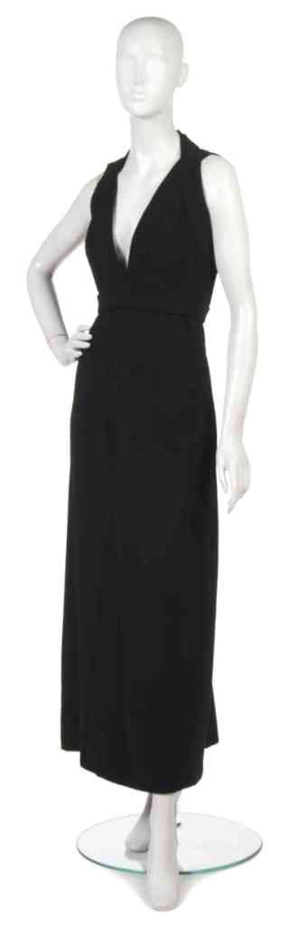 A Donald Brooks Black Wool Evening Gown,: A Donald Brooks Black Wool Evening Gown, with rhinestone buckle details. Labeled: Donald Brooks.