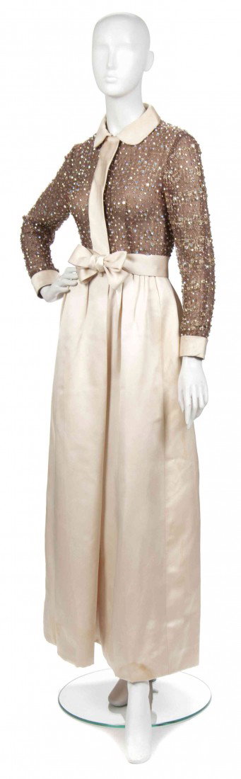 A Geoffrey Beene Cream Silk and Gold Beaded Evenin: A Geoffrey Beene Cream Silk and Gold Beaded Evening Gown, 1960s, with a sheer silk bodice, full skirt. Labeled: Geoffrey Beene.