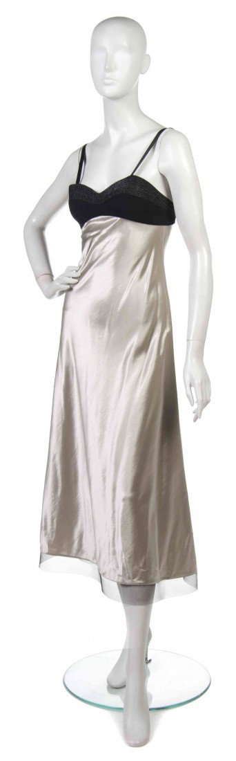 A Geoffrey Beene Black Silver Satin Evening Dress,: A Geoffrey Beene Black Silver Satin Evening Dress, with a black wool bust, flared skirt. Labeled: Geoffrey Beene.