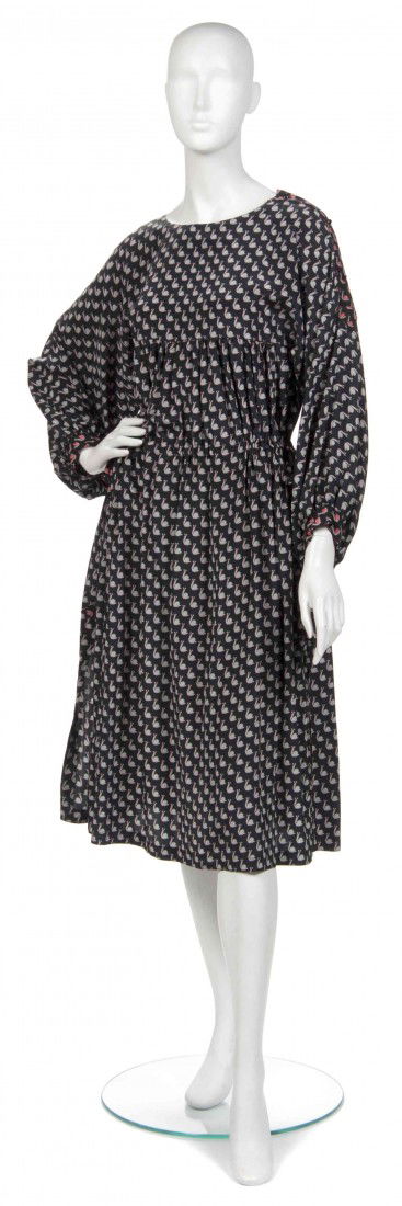 A Joan Vass Black Silk Peasant Dress,: A Joan Vass Black Silk Peasant Dress, in a snail print motif with a drawstring waist and long sleeves. Labeled: Joan Vass N.Y. Property from the Estate of Joan Vass, New York, New York