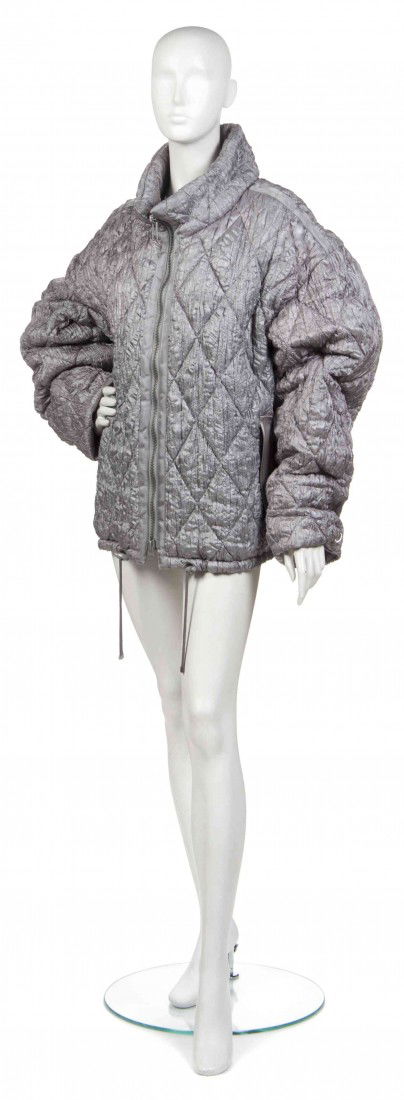 An Issey Miyake Silver Textured Quilted Coat.: An Issey Miyake Silver Textured Quilted Coat. Labeled: Issey Miyake. Property from the Estate of Joan Vass, New York, New York