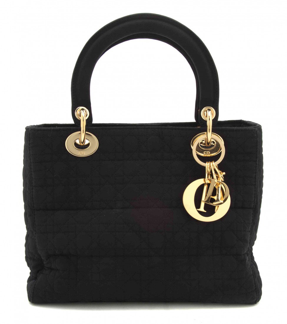 A Christian Dior Black Silk Bag, 10 x 7 inches.: A Christian Dior Black Silk Bag, with goldtone hardware, 'DIOR' charm keychain attached. Stamped: Christian Dior. 10 x 7 inches.