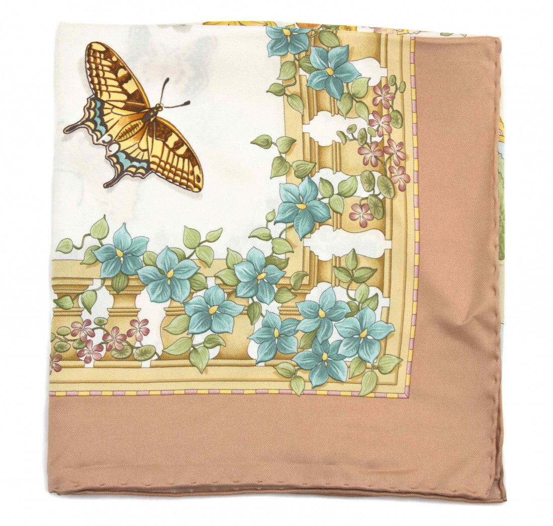 A Ferragamo Silk Scarf, 35 x 35 inches.: A Ferragamo Silk Scarf, in a floral motif. Labeled: Ferragamo. 35 x 35 inches.