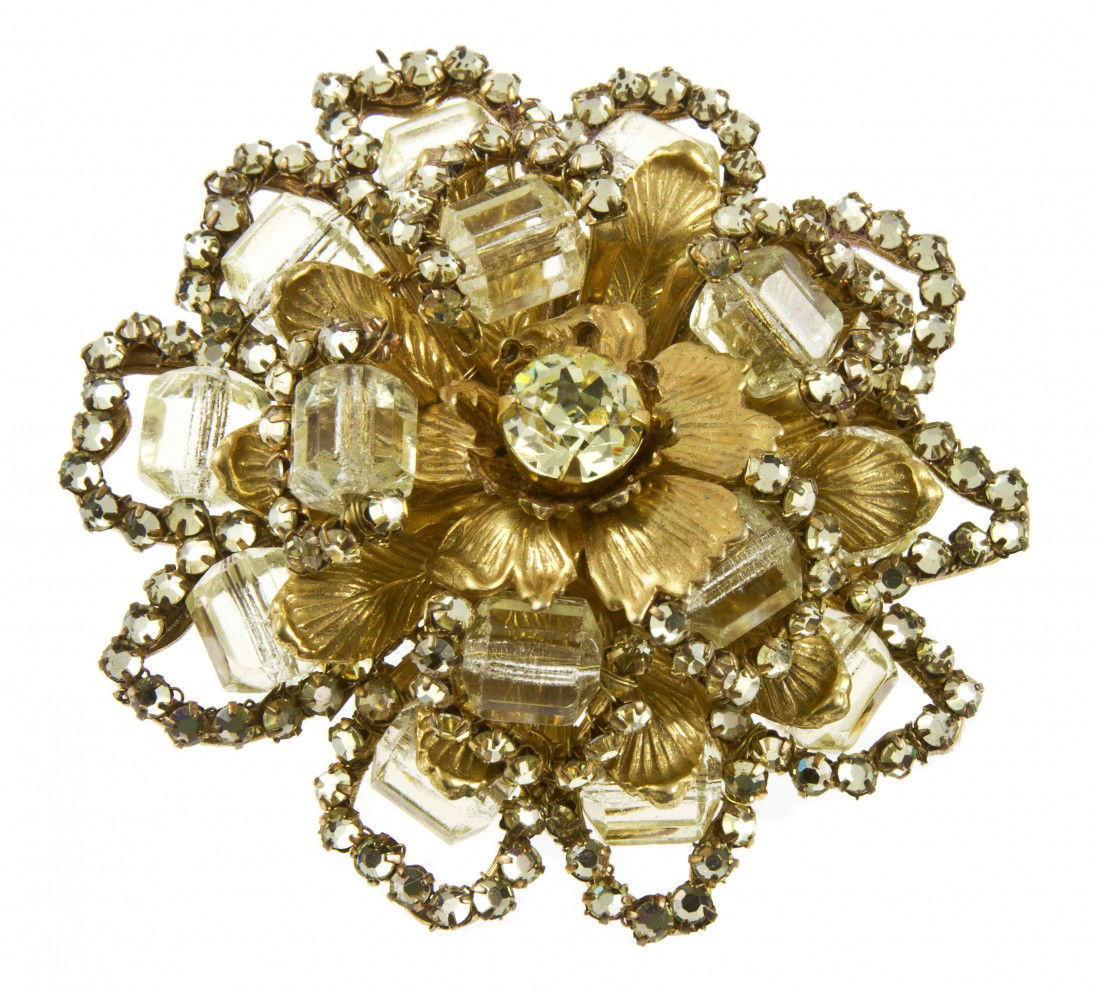 A Miriam Haskell Green Crystal Floral Brooch.: A Miriam Haskell Green Crystal Floral Brooch. Stamped: Miriam Haskell.