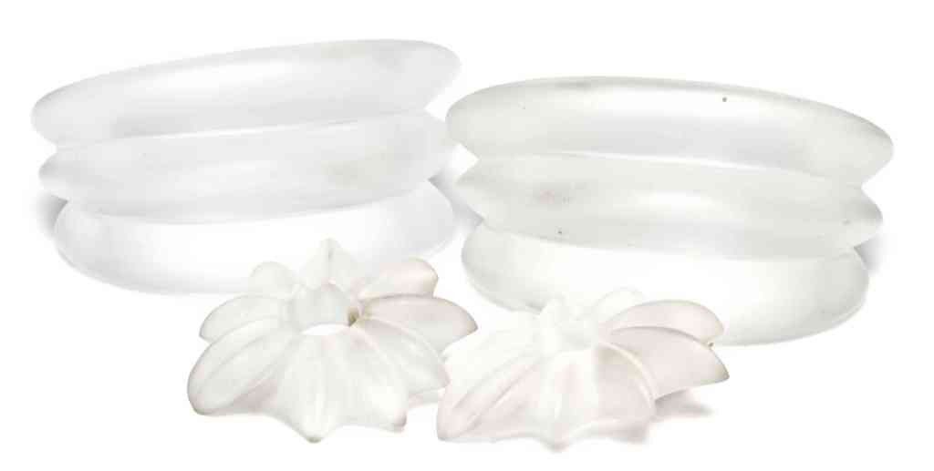 Two Gerda Lynggaard Matching White Resin Cuffs,: Two Gerda Lynggaard Matching White Resin Cuffs, together with matching earclips. Stamped: Gerda Lynggaard/Monies.