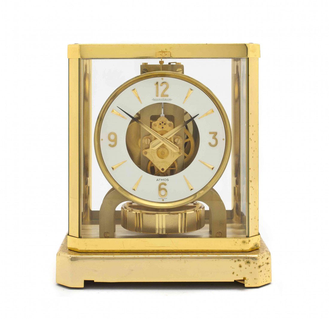 A Jaeger-Le Coultre Brass Atmos Clock, Height 9 1/2: A Jaeger-Le Coultre Brass Atmos Clock, having a rectangular case centered with a circular dial having Arabic numerals. Height 9 1/2 inches. Property from the Collection of Robert and David Smith, Mich