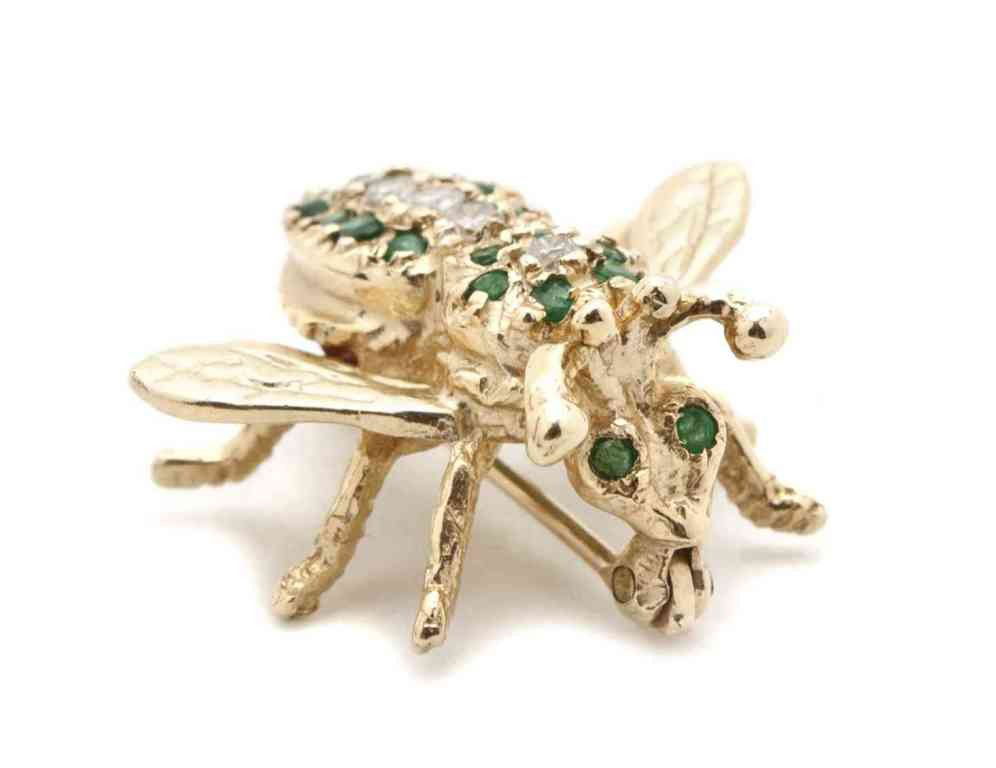 A 14 Karat Gold, Diamond, and Emerald Pin,: A 14 Karat Gold, Diamond, and Emerald Pin, depicting a bee. Property from the Collection of Robert and David Smith, Michigan