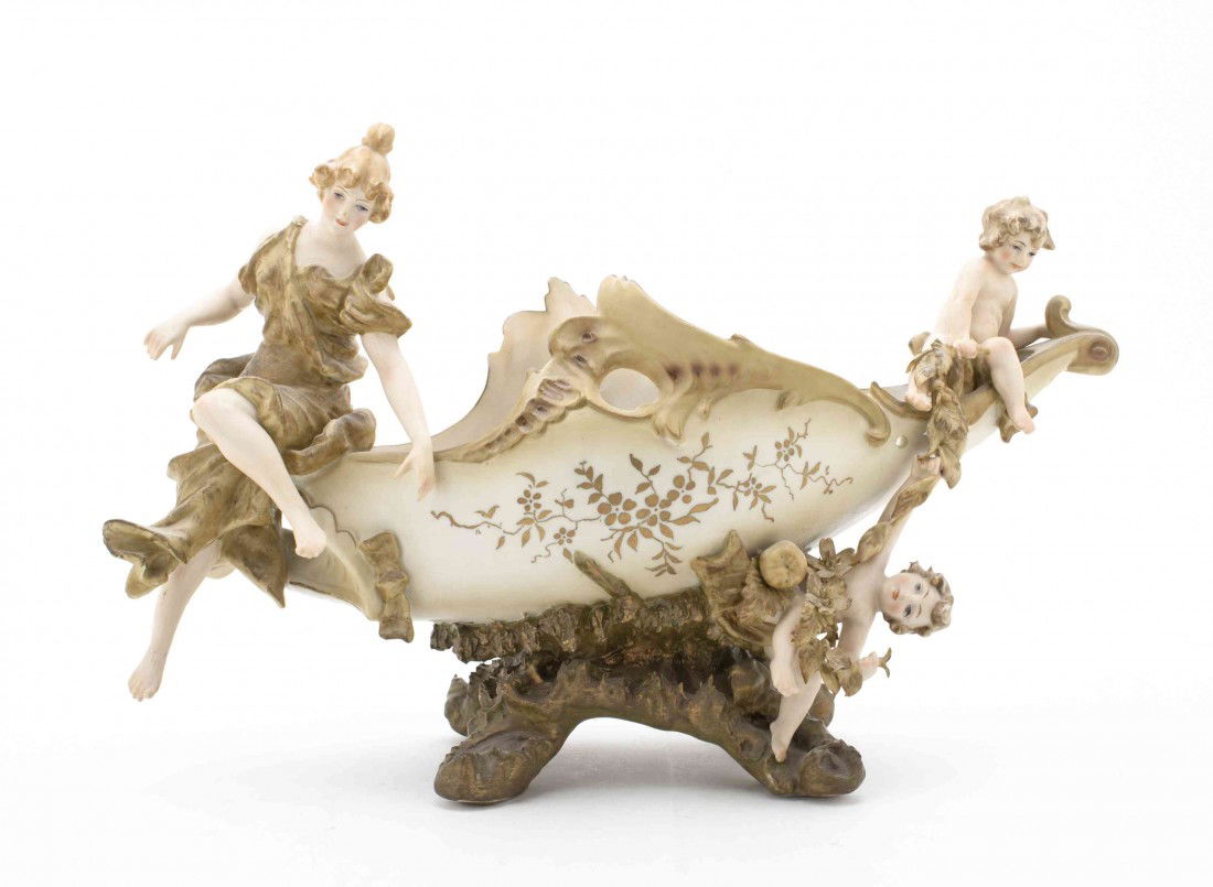 A Berlin (K.P.M) Porcelain Art Nouveau Polychrome C: A Berlin (K.P.M) Porcelain Art Nouveau Polychrome Center Bowl, of oval form, depicting a woman and children atop the rim, with foliate decoration throughout. Height 8 1/2 inches. Property from the Est