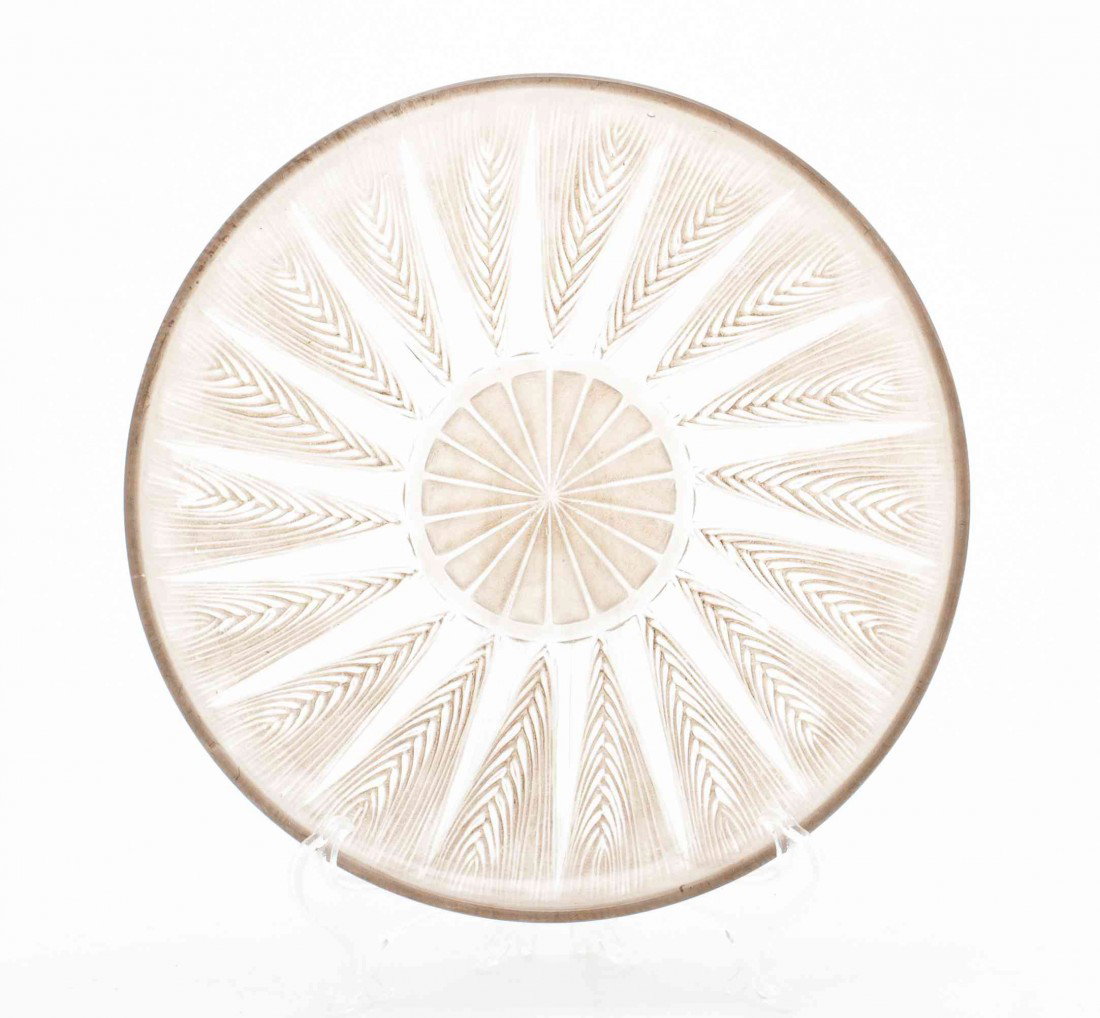 A Rene Lalique Glass Plate, Diameter 7 1/2 inches.: A Rene Lalique Glass Plate, the central rosette radiating ears of wheat, having overall pale brown hue. Diameter 7 1/2 inches. Property from the Estate of Wayne D. Hales, Oklahoma City, Oklahoma