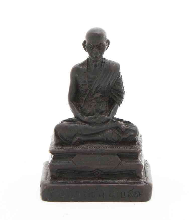 A Burmese Stone Figure of a Lama, Height 3 1/2 inc: A Burmese Stone Figure of a Lama, 20th century, in a seated pose upon a squared multi-tiered base. Height 3 1/2 inches. Property from the Collection of Walter Phelps Scott, San Miguel de Allende, Guan