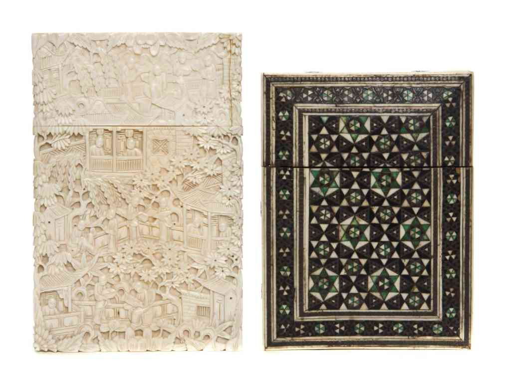 A Chinese Carved Ivory Card Case, Height of talles: A Chinese Carved Ivory Card Case, of rectangular form with a village scene carved throughout, together with a bone inlaid card case. Height of tallest 4 1/2 inches. Property from the Collection of Lar